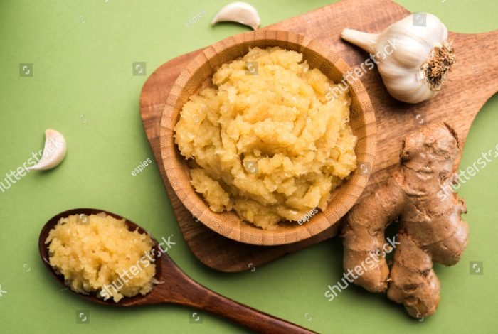 stock-photo-ginger-garlic-paste-fresh-mashed-adrak-and-lahsun-in-wooden-bowl-and-whole-over-moody-colourful-791435833